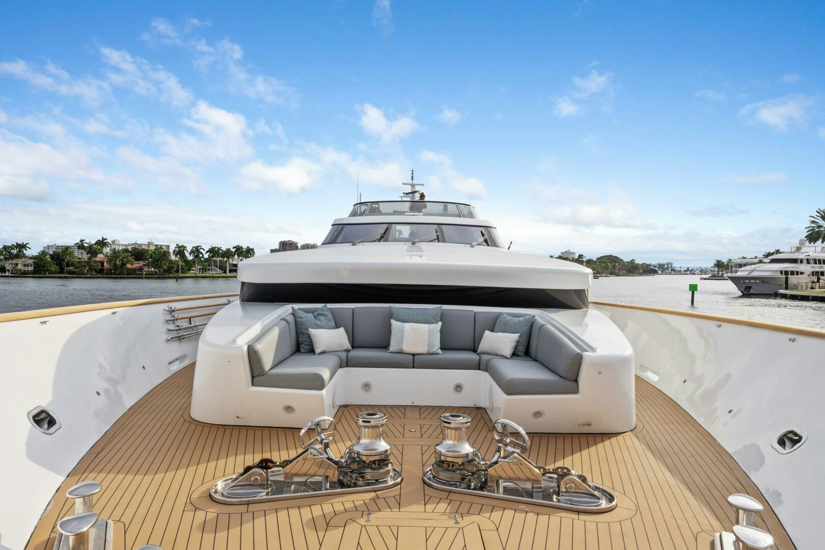 a white car on a wooden deck aboard GLADIUS Yacht for Sale