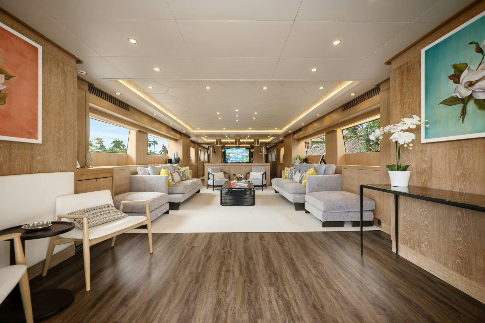 a living room with a wood floor aboard GLADIUS Yacht for Sale