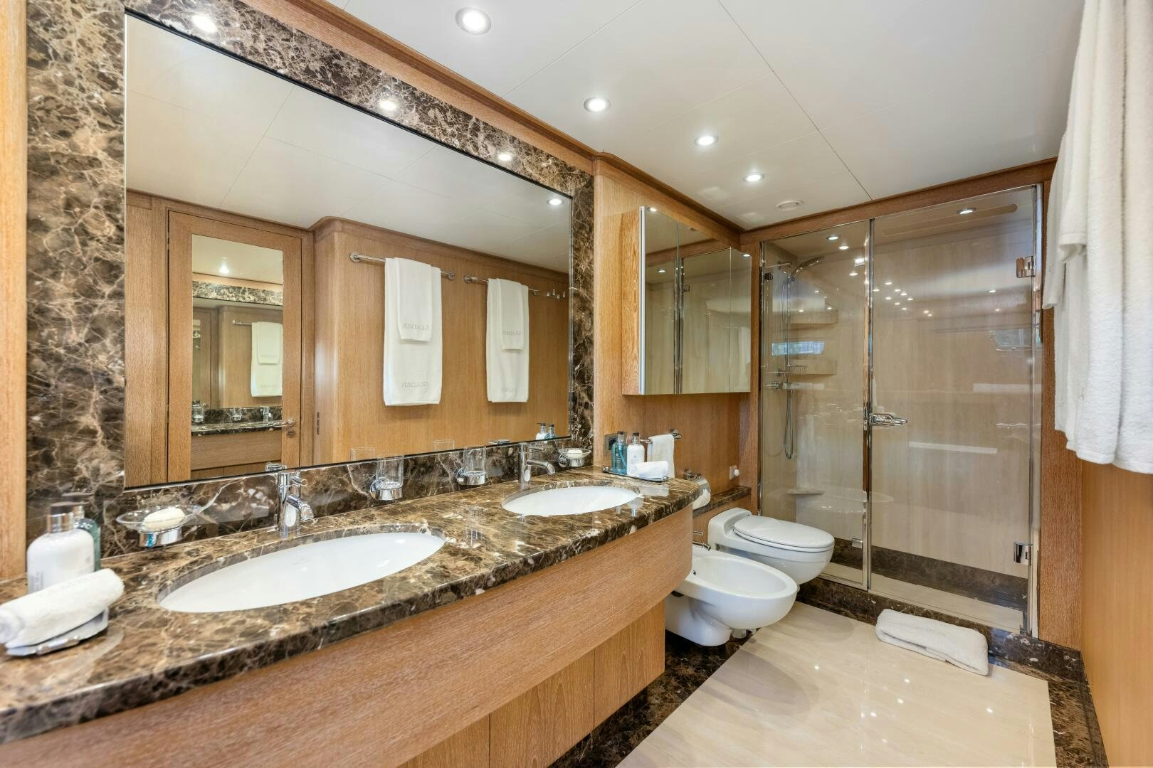 a bathroom with a large mirror aboard GLADIUS Yacht for Sale