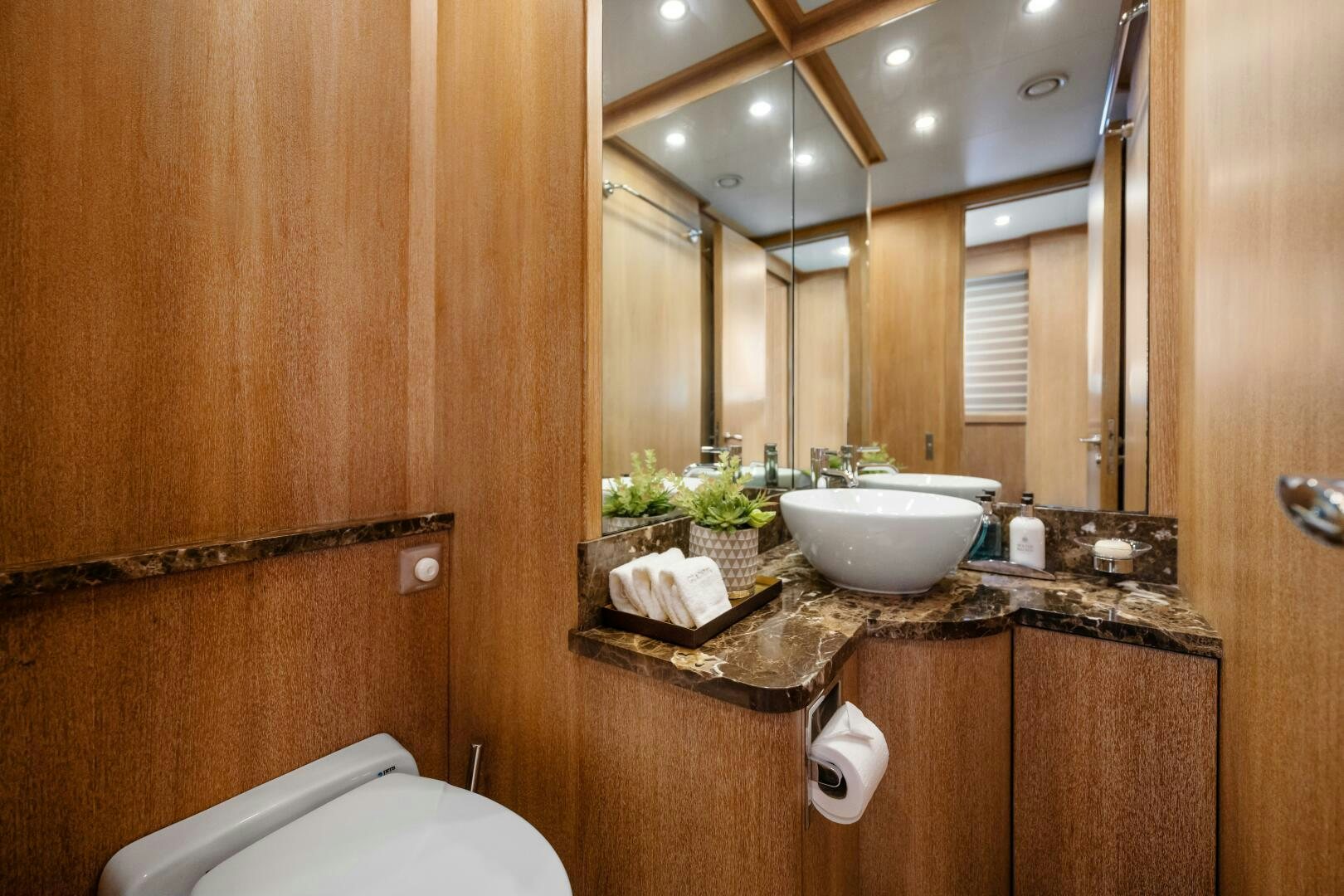 a bathroom with a sink and a mirror aboard GLADIUS Yacht for Sale