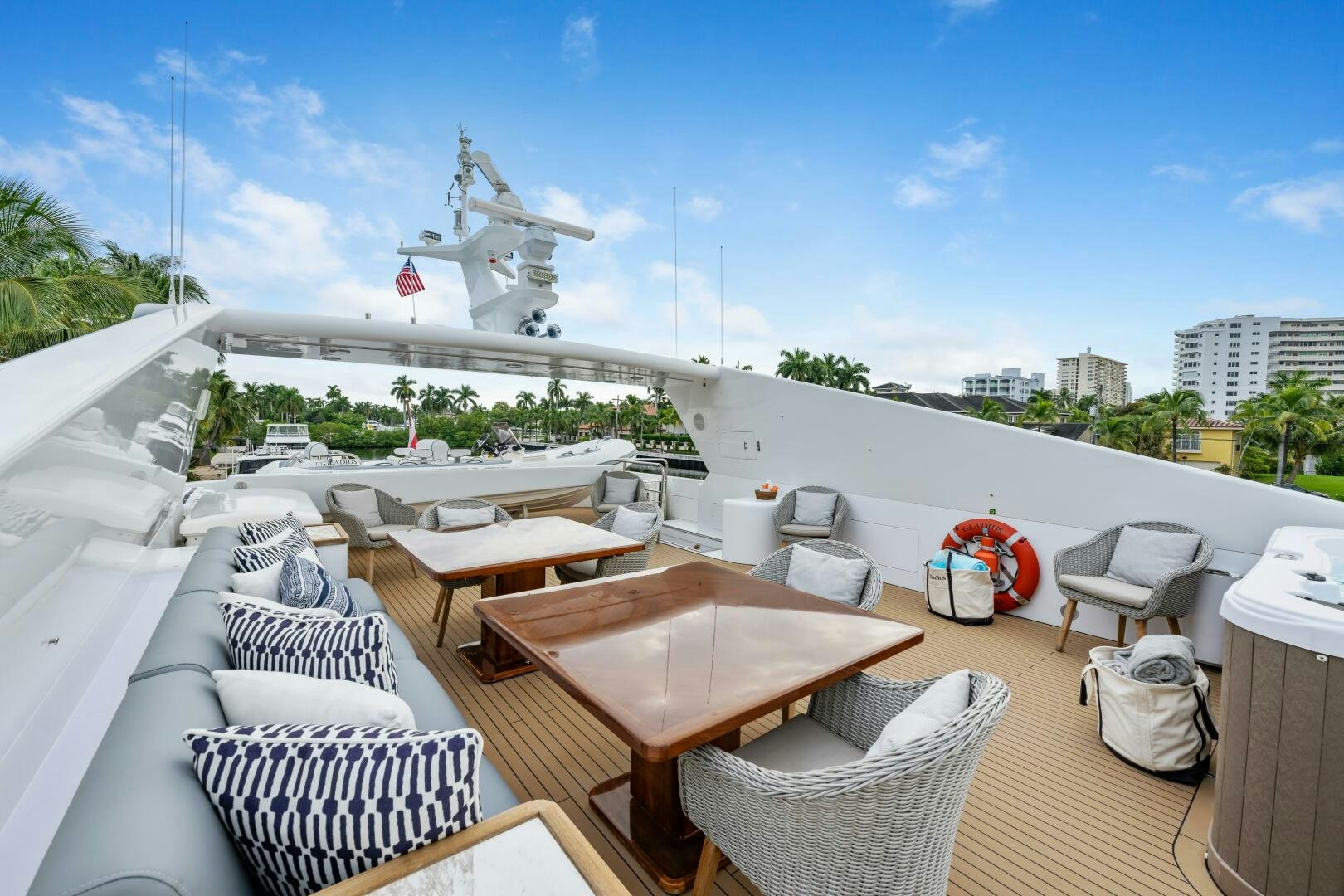 a deck with chairs and tables on it aboard GLADIUS Yacht for Sale