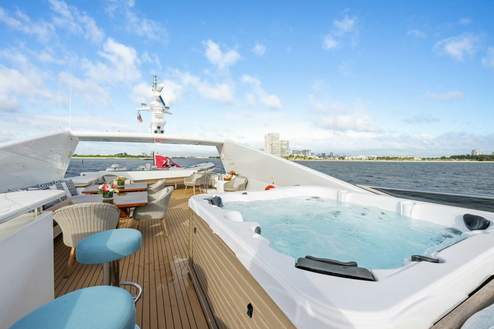 a deck with a deck and chairs on it and a space shuttle on the back aboard GLADIUS Yacht for Sale