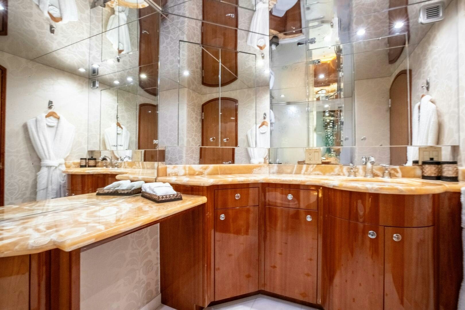 a kitchen with wooden cabinets aboard PIRATE RADIO Yacht for Sale