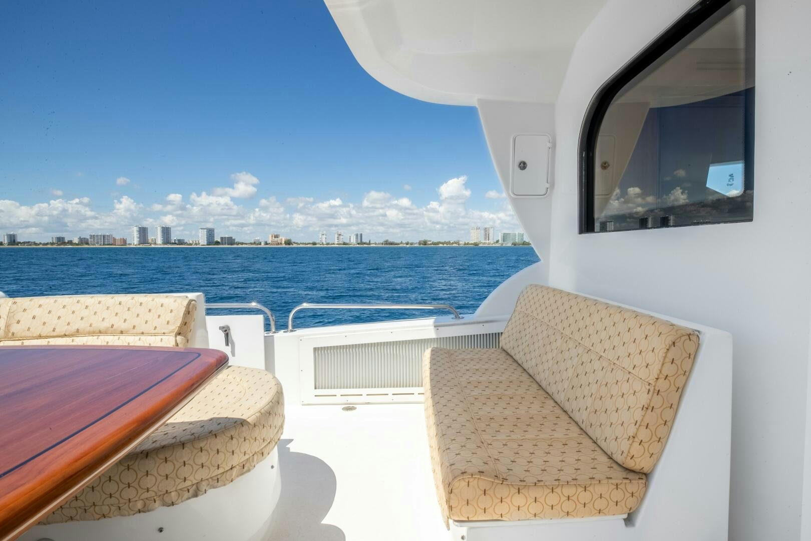 a room with a view of the ocean and a city aboard PIRATE RADIO Yacht for Sale
