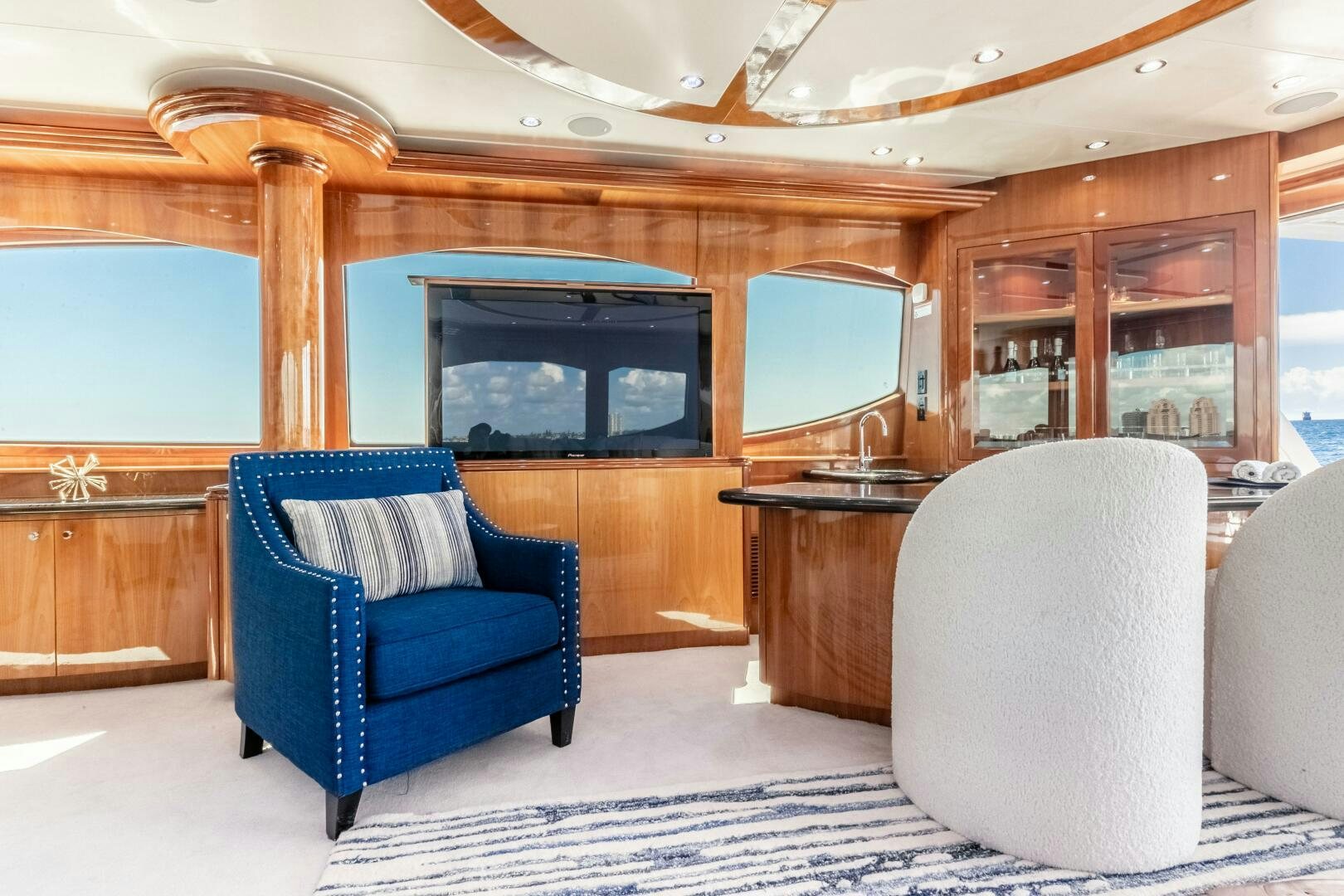 a room with a chair and a fireplace aboard PIRATE RADIO Yacht for Sale