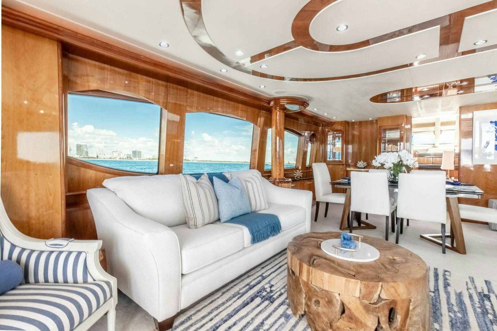 a living room with a couch and a table aboard PIRATE RADIO Yacht for Sale