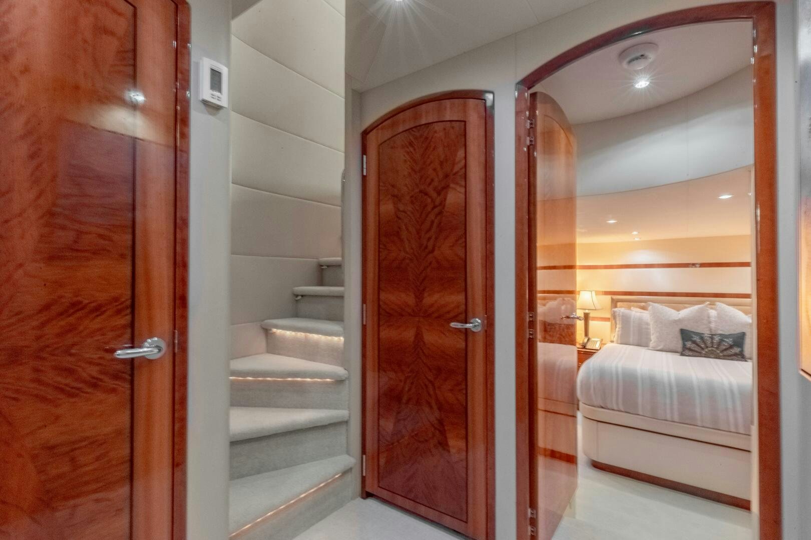 a room with a bed and a mirror aboard PIRATE RADIO Yacht for Sale