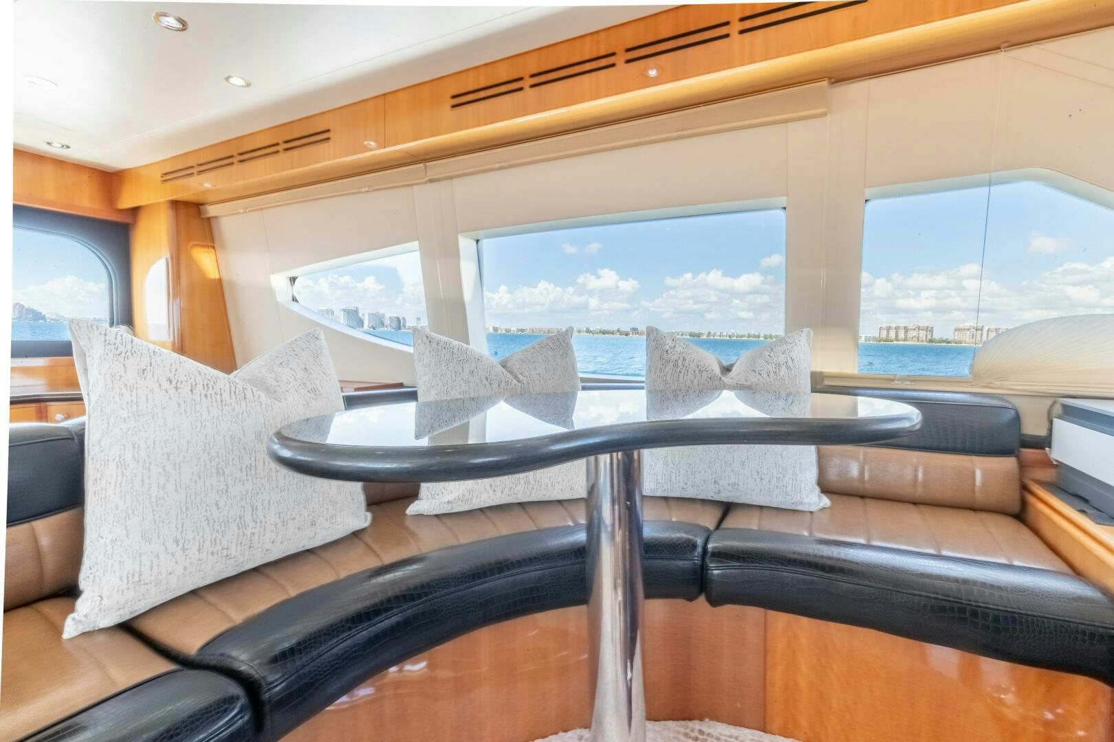 a room with a couch and a large window aboard PIRATE RADIO Yacht for Sale