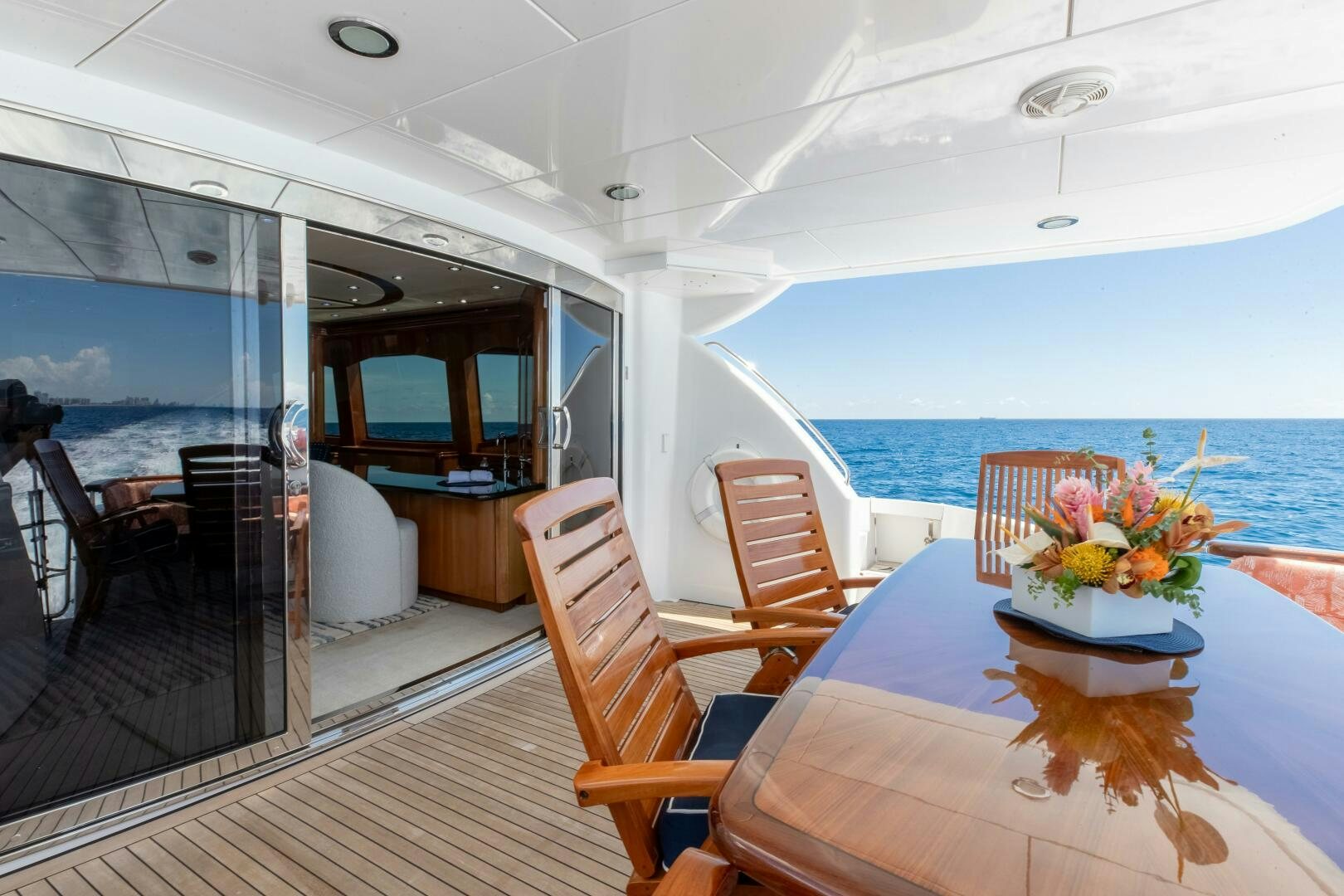 a large living room with a large balcony aboard PIRATE RADIO Yacht for Sale