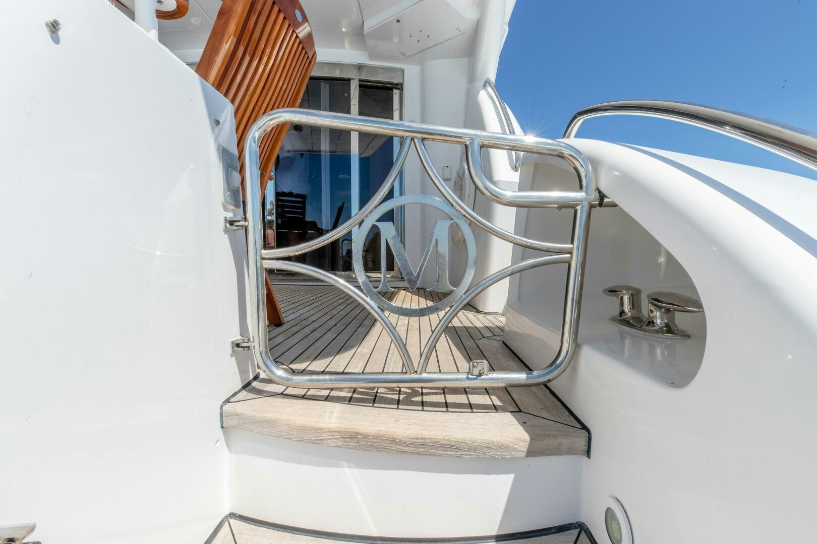 a close-up of a white car's hood aboard PIRATE RADIO Yacht for Sale