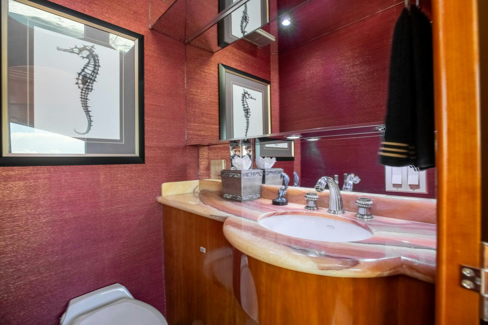 a bathroom with a sink and a mirror aboard PIRATE RADIO Yacht for Sale