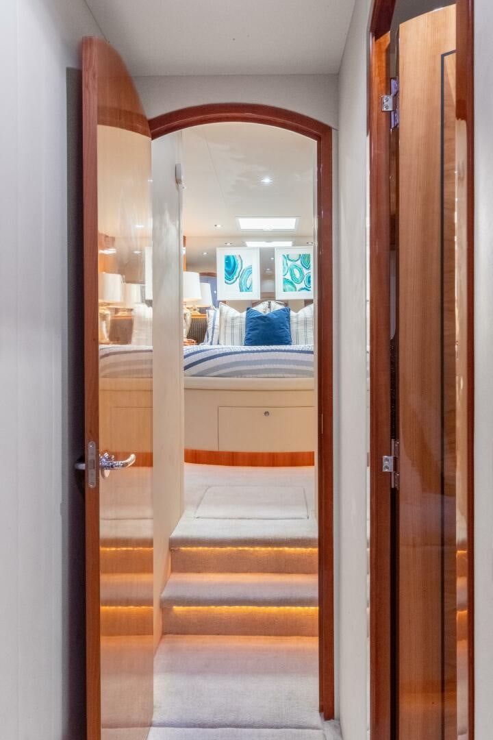 a room with a bed and a mirror aboard PIRATE RADIO Yacht for Sale