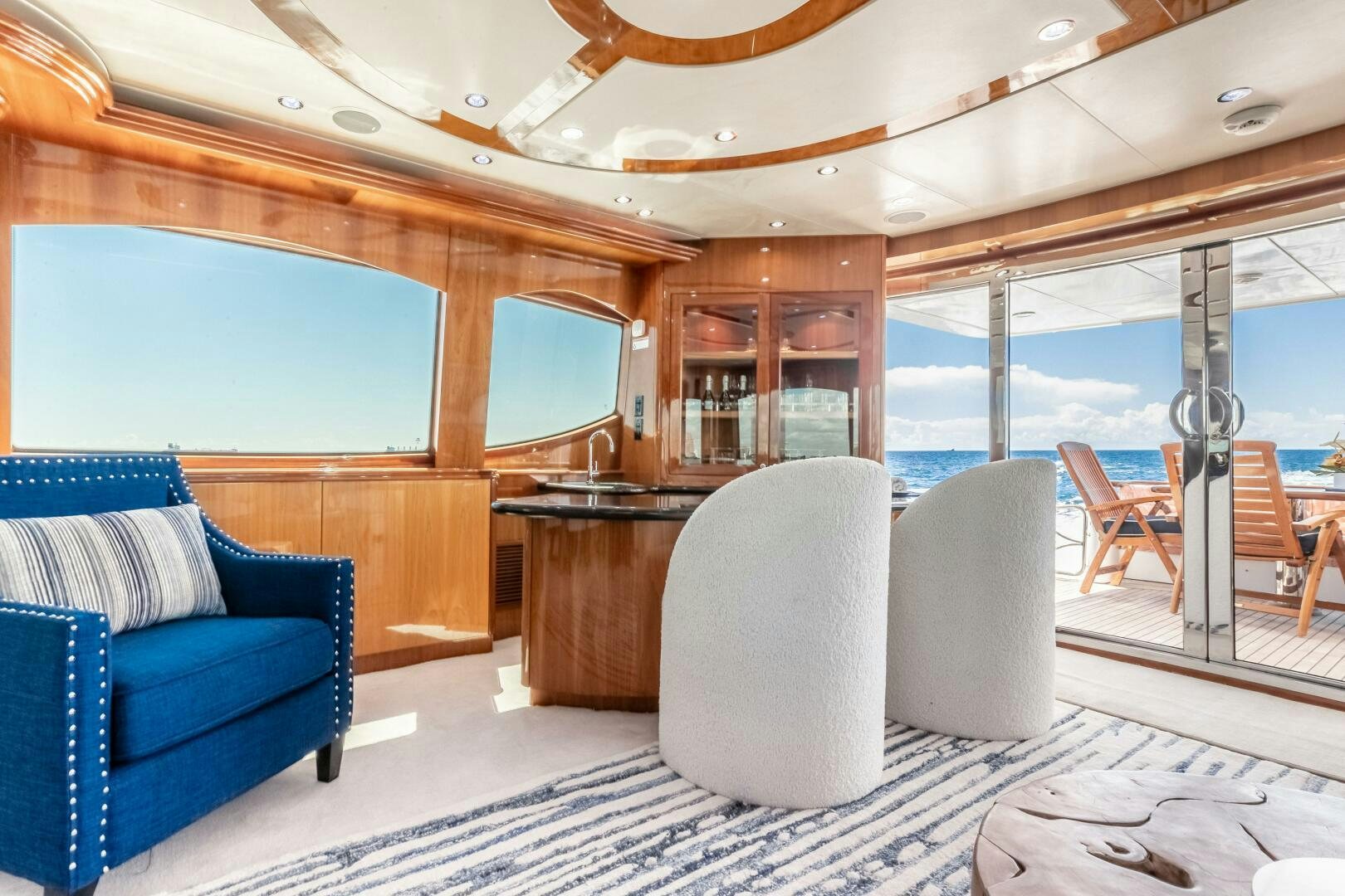 a room with a table chairs and a large window aboard PIRATE RADIO Yacht for Sale