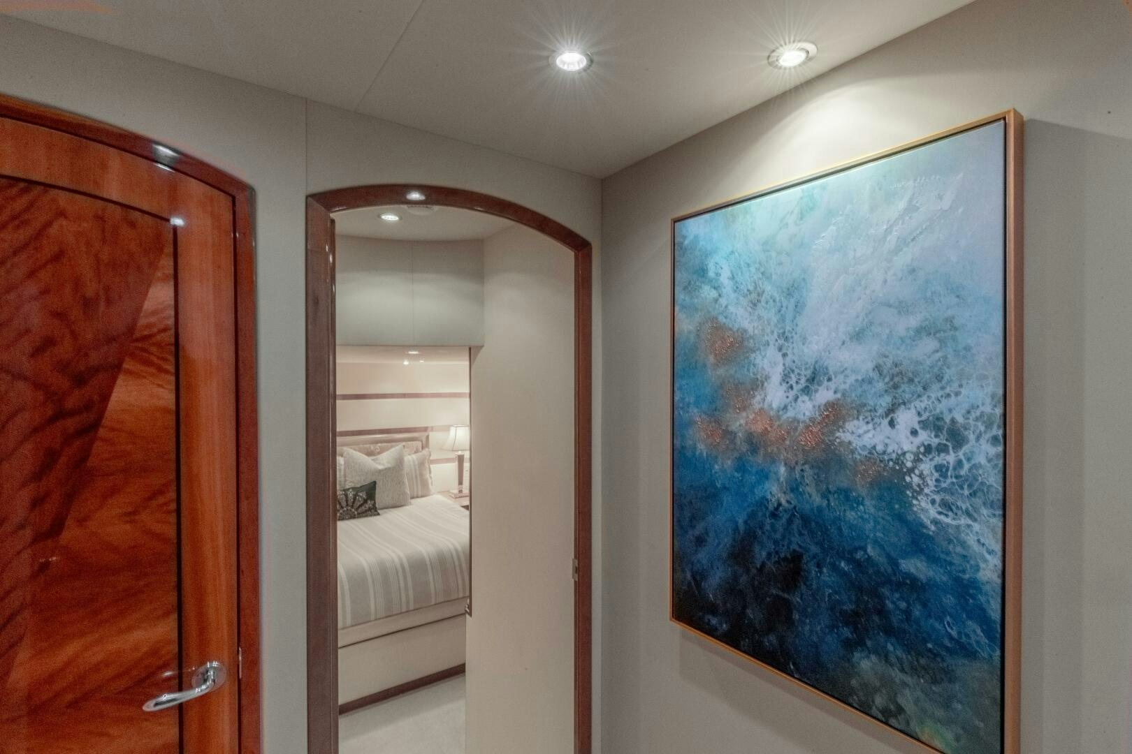 a room with a painting on the wall aboard PIRATE RADIO Yacht for Sale