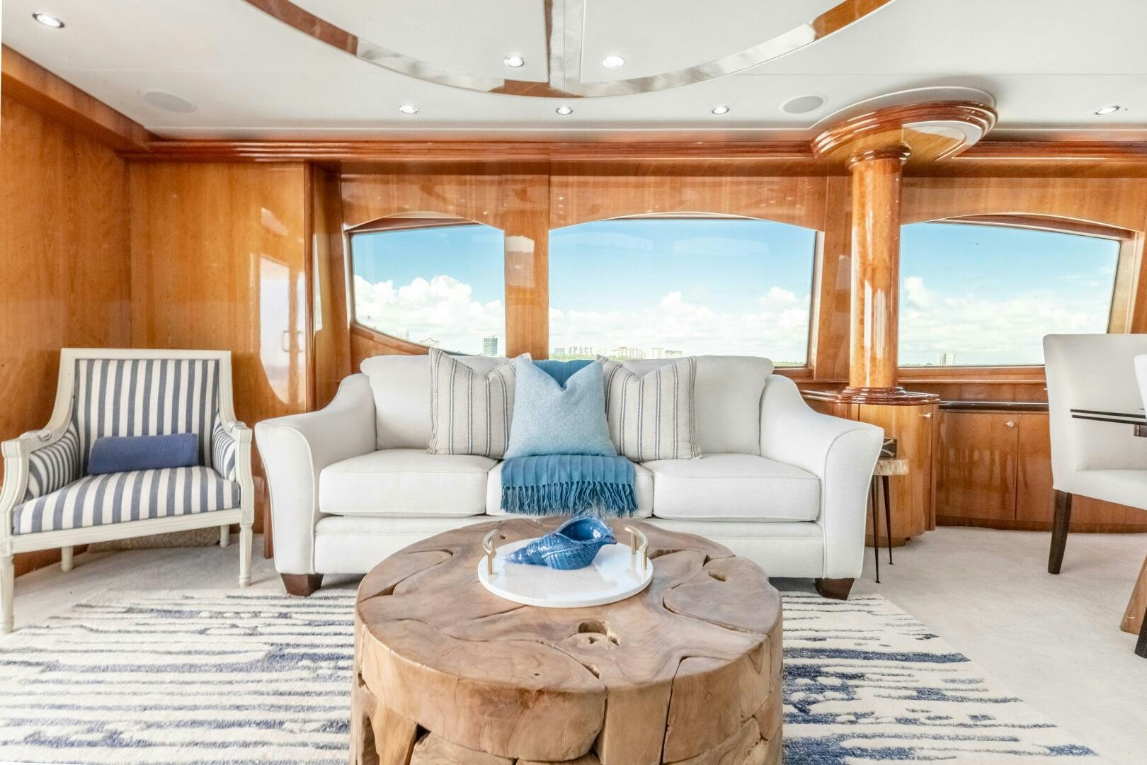 a room with a table chairs and a large window aboard PIRATE RADIO Yacht for Sale