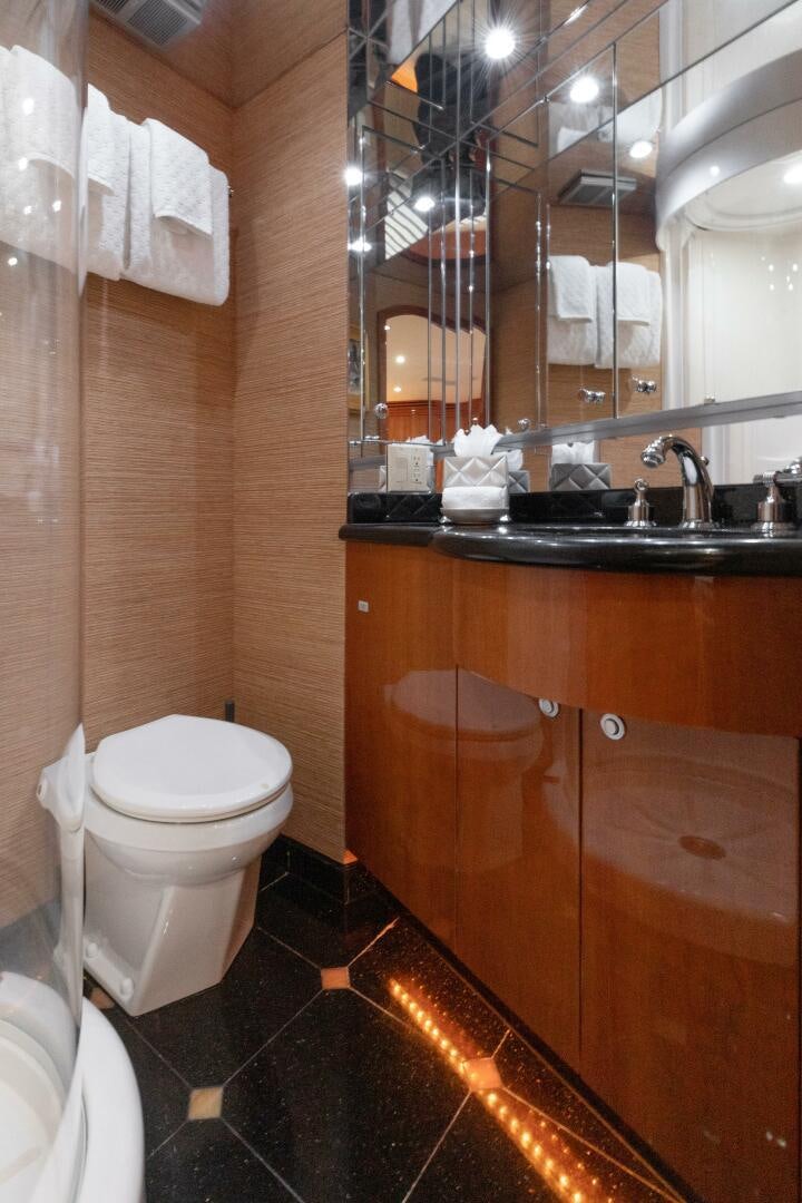 a bathroom with a toilet and a sink aboard PIRATE RADIO Yacht for Sale