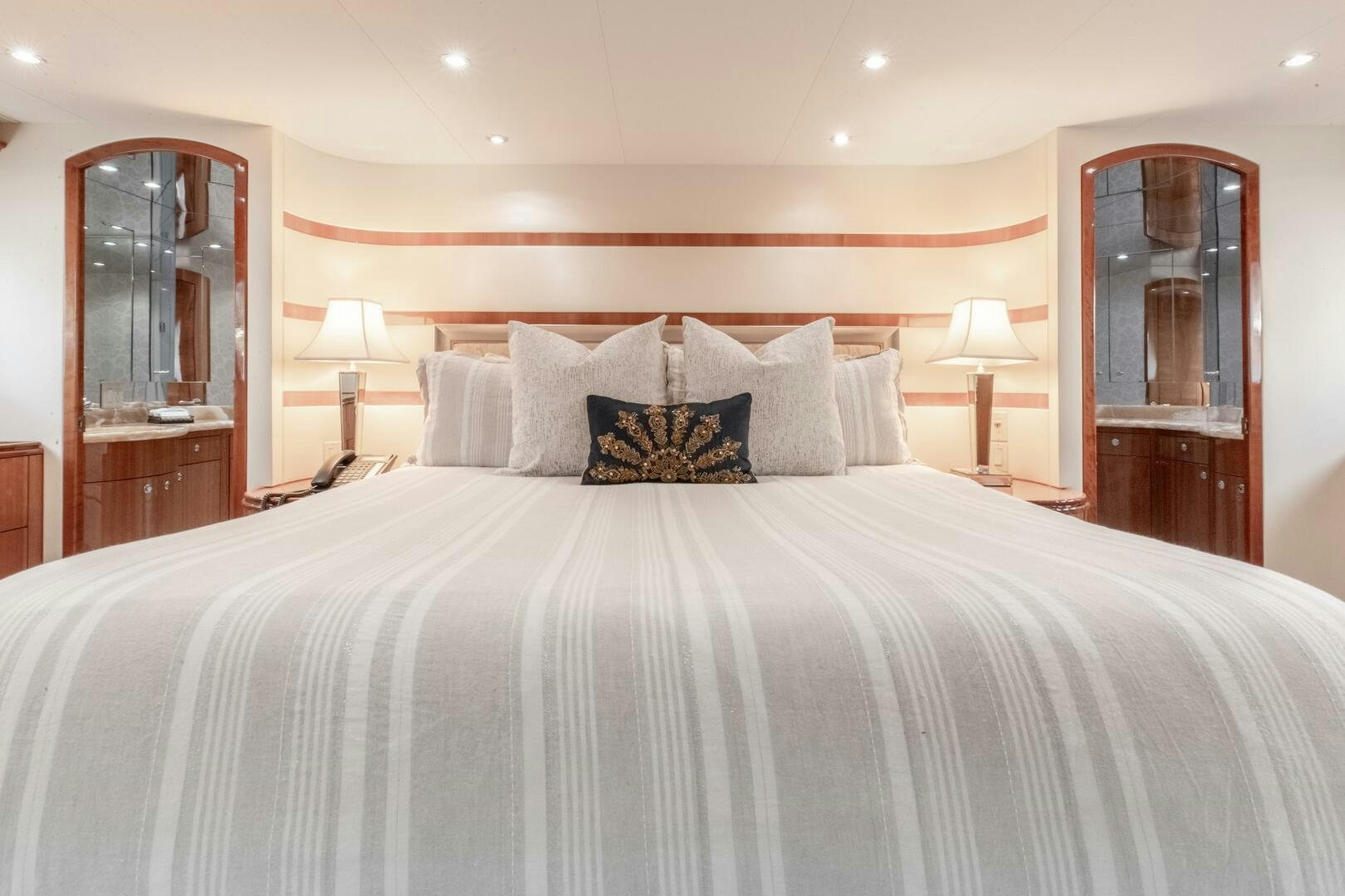 a bed with a white comforter aboard PIRATE RADIO Yacht for Sale