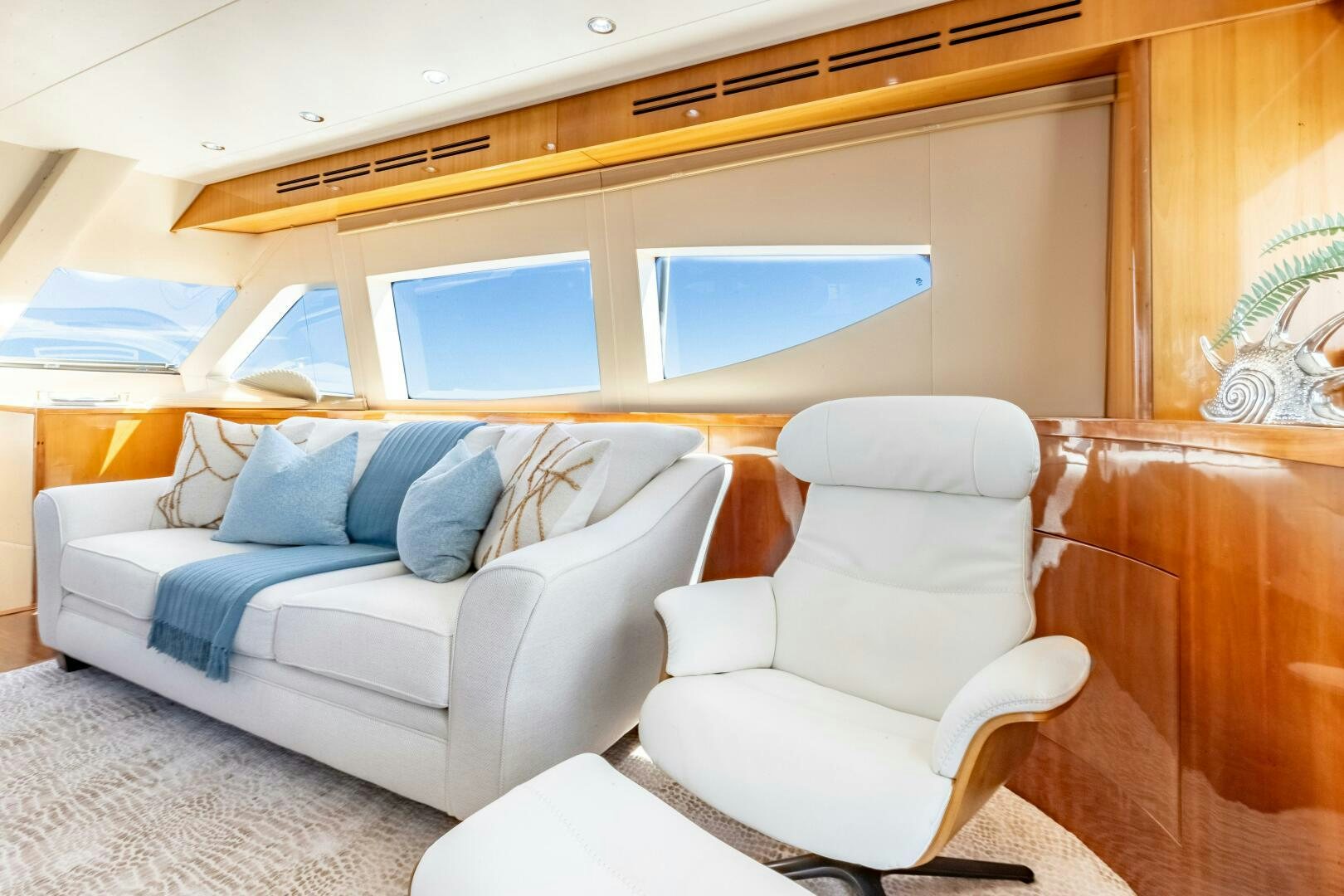 a room with a couch and a bed aboard PIRATE RADIO Yacht for Sale