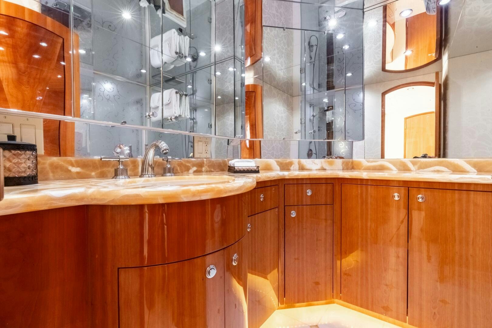 a kitchen with wooden cabinets aboard PIRATE RADIO Yacht for Sale