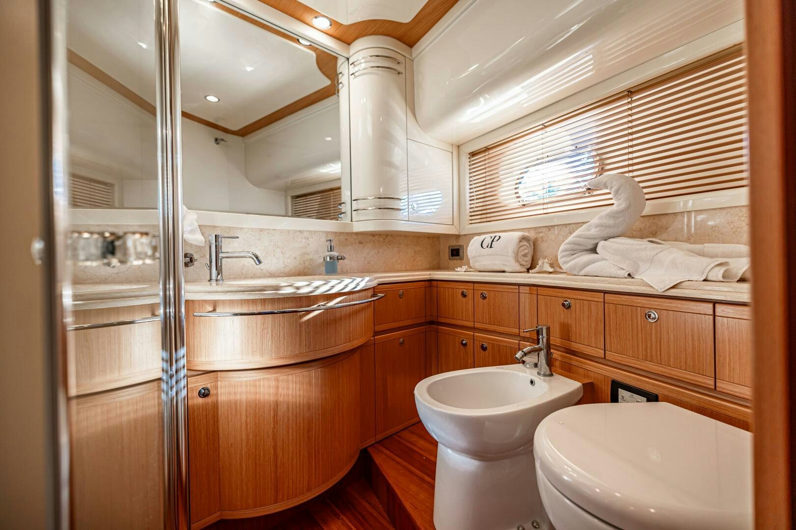 a bathroom with a glass shower aboard CRYSTAL PARROT Yacht for Sale