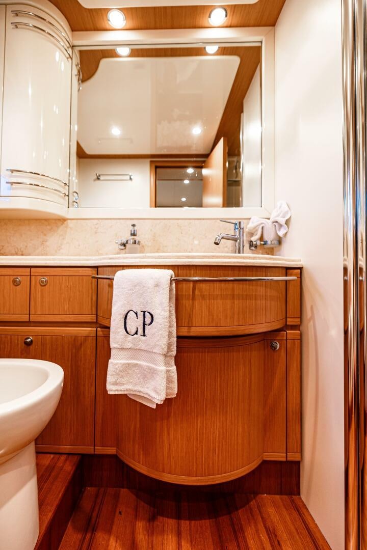 a bathroom with a sink and a mirror aboard CRYSTAL PARROT Yacht for Sale