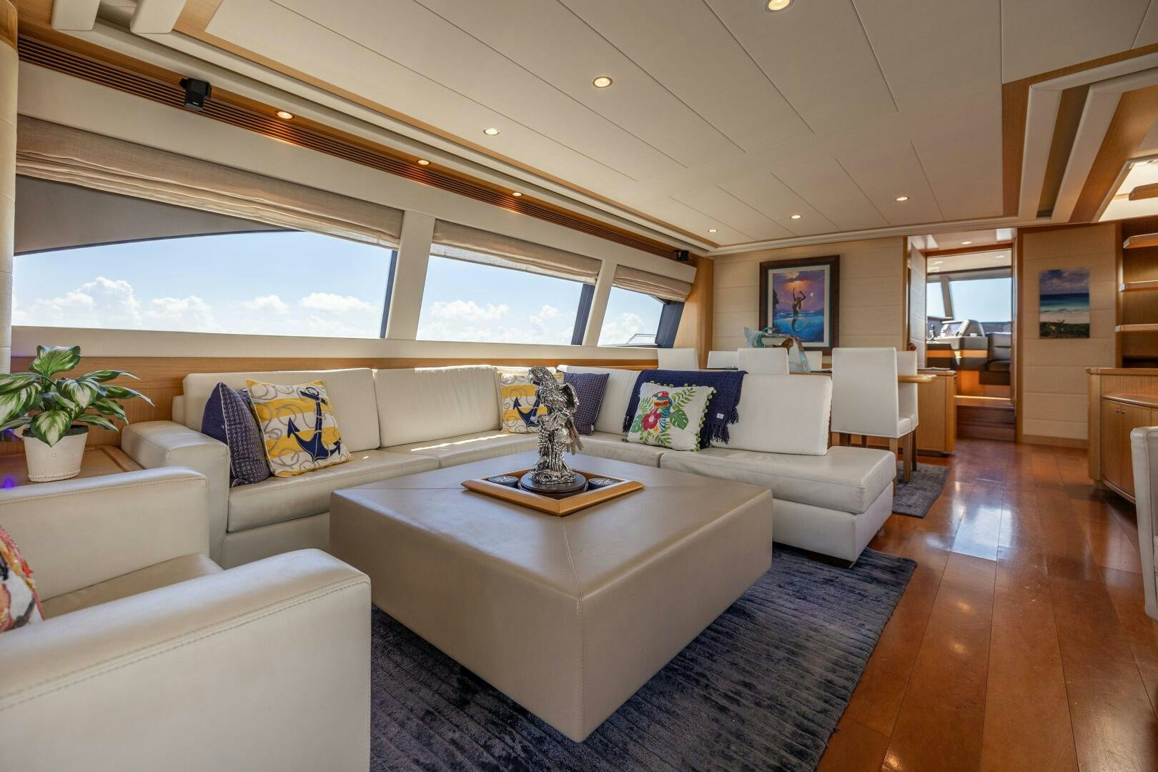 a living room with a large window aboard CRYSTAL PARROT Yacht for Sale