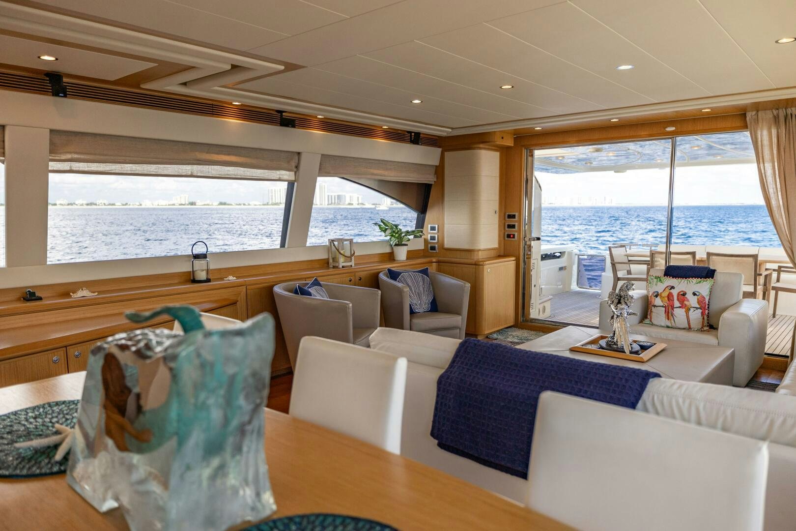 a living room with a large window aboard CRYSTAL PARROT Yacht for Sale