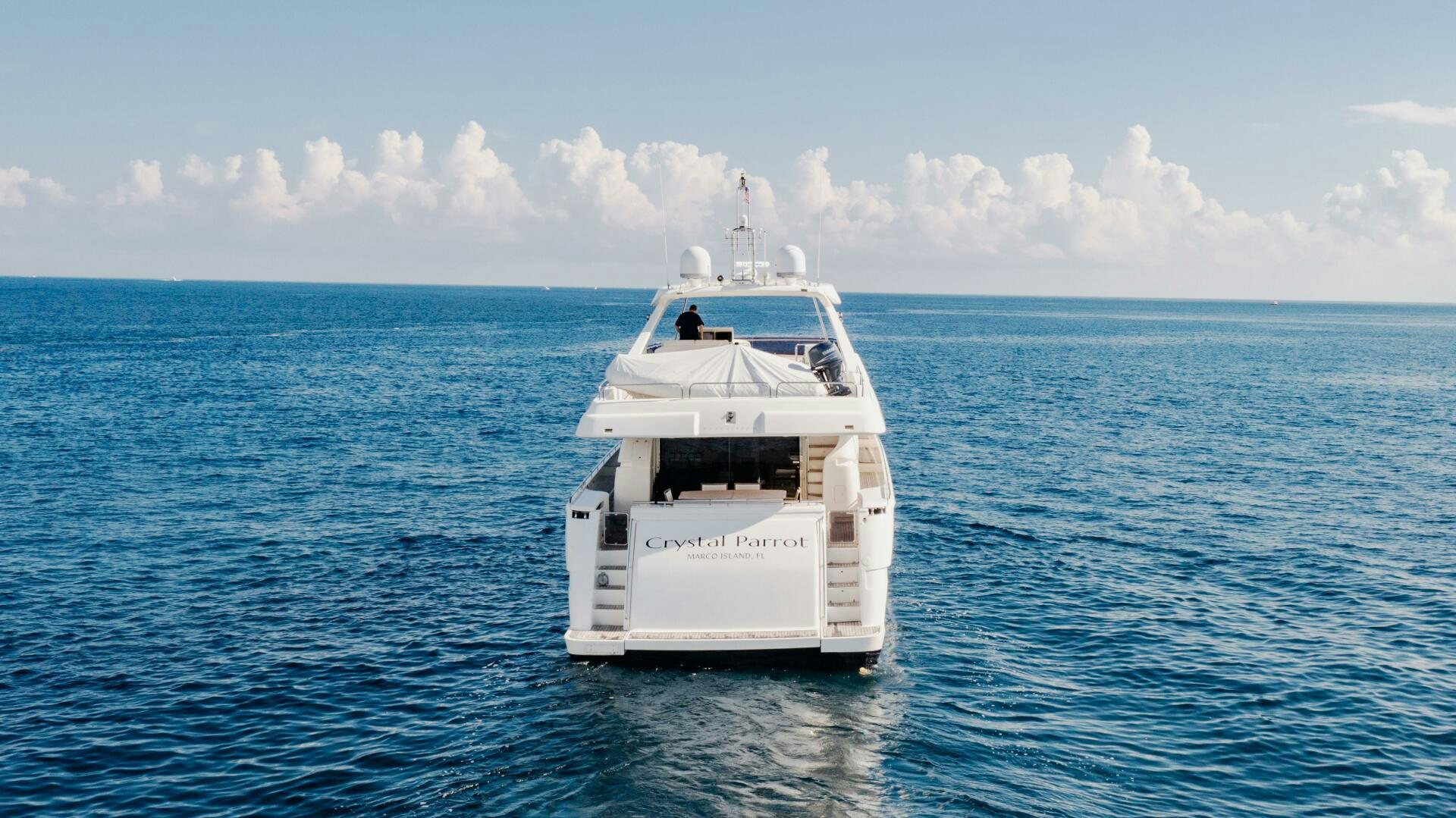 a white boat in the water aboard CRYSTAL PARROT Yacht for Sale