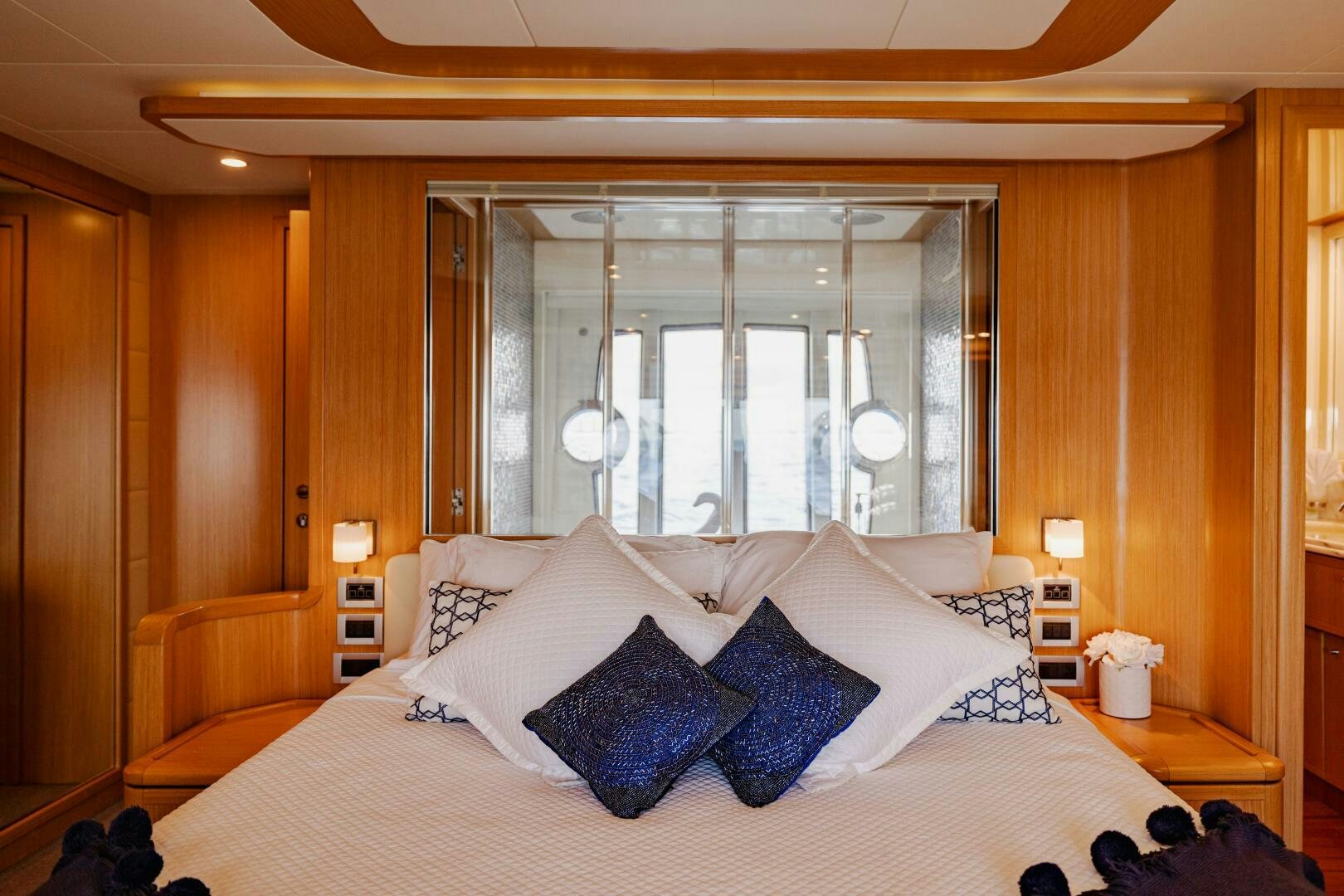 a bed with white sheets and pillows aboard CRYSTAL PARROT Yacht for Sale