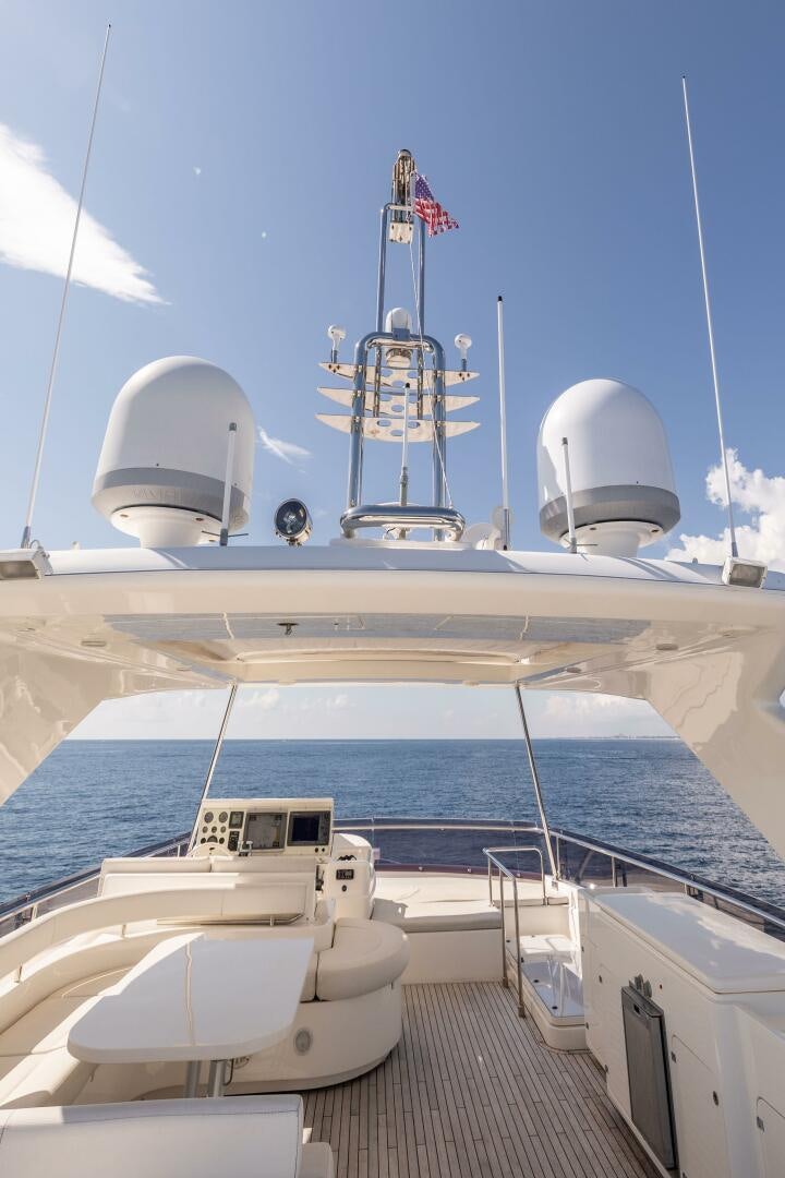 a large ship with a satellite dish on the deck aboard CRYSTAL PARROT Yacht for Sale
