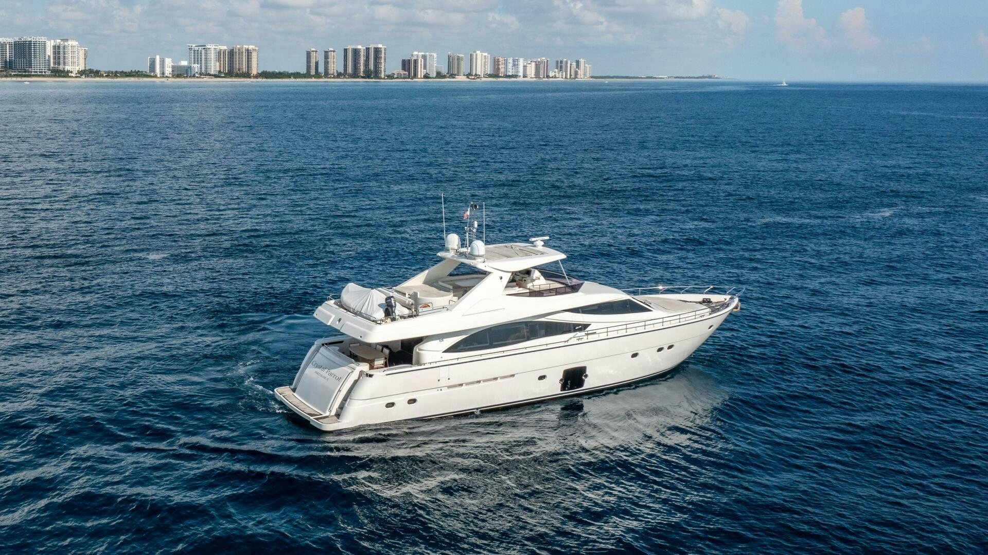 a white yacht in the water aboard CRYSTAL PARROT Yacht for Sale