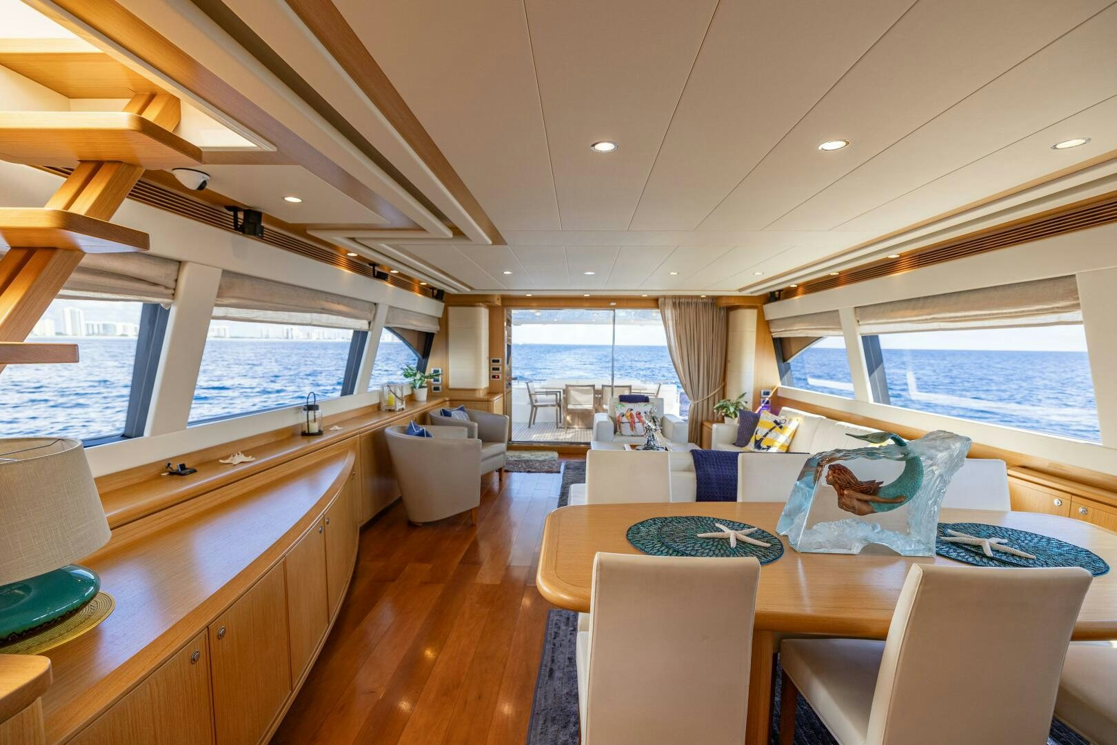 a room with a table and chairs aboard CRYSTAL PARROT Yacht for Sale