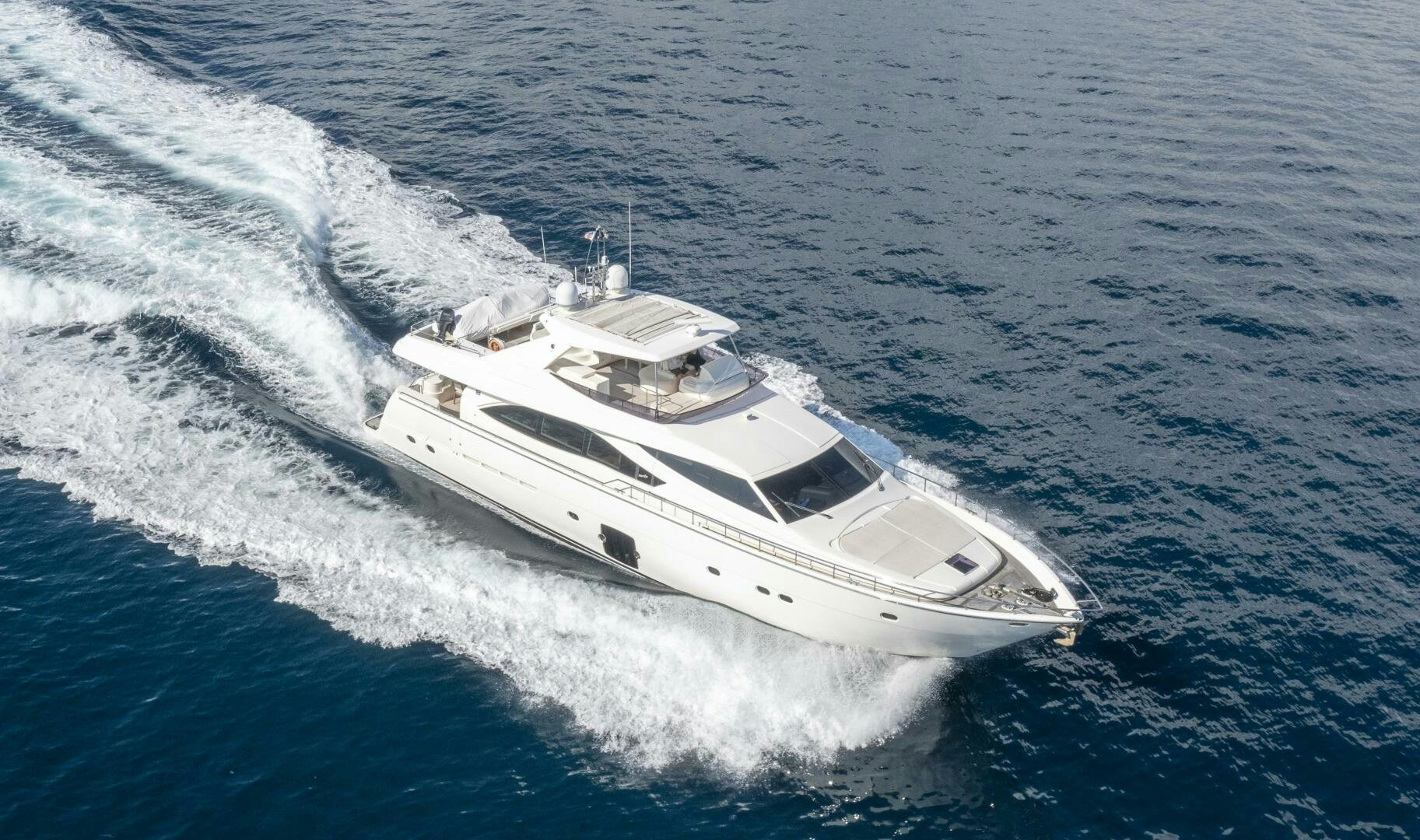 a white yacht on the water aboard CRYSTAL PARROT Yacht for Sale