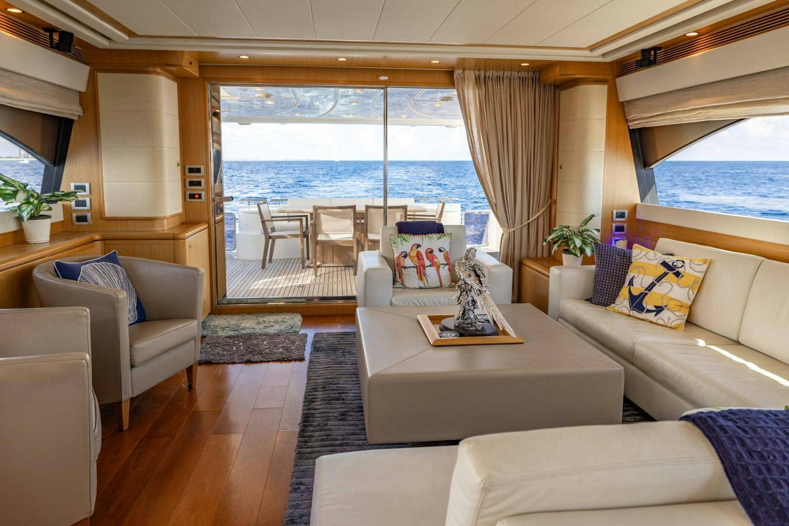 a living room with a large window aboard CRYSTAL PARROT Yacht for Sale