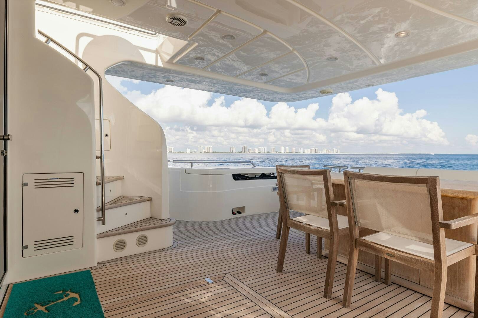 a room with a table chairs and a large window aboard CRYSTAL PARROT Yacht for Sale