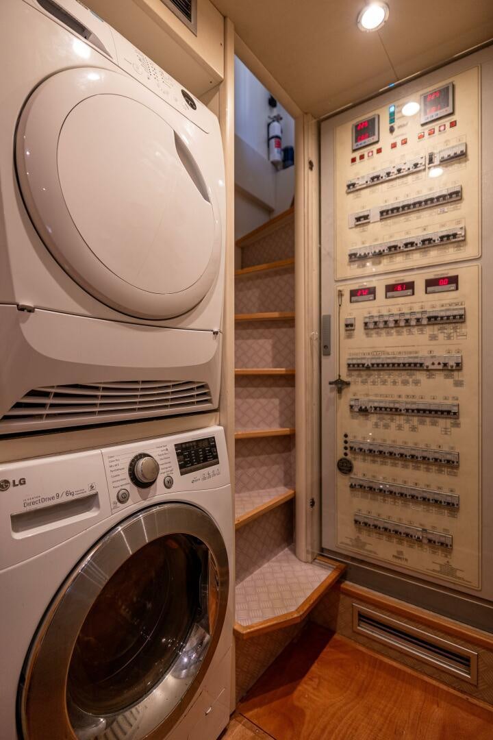 a washing machine in a room aboard CRYSTAL PARROT Yacht for Sale