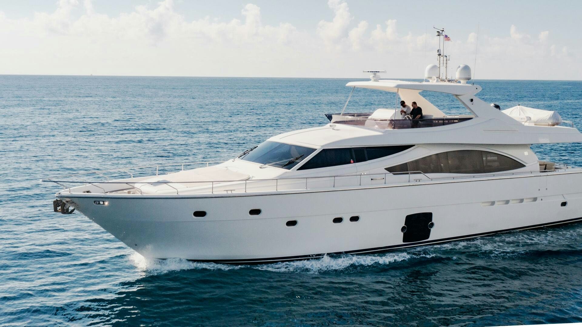 a white yacht in the ocean aboard CRYSTAL PARROT Yacht for Sale