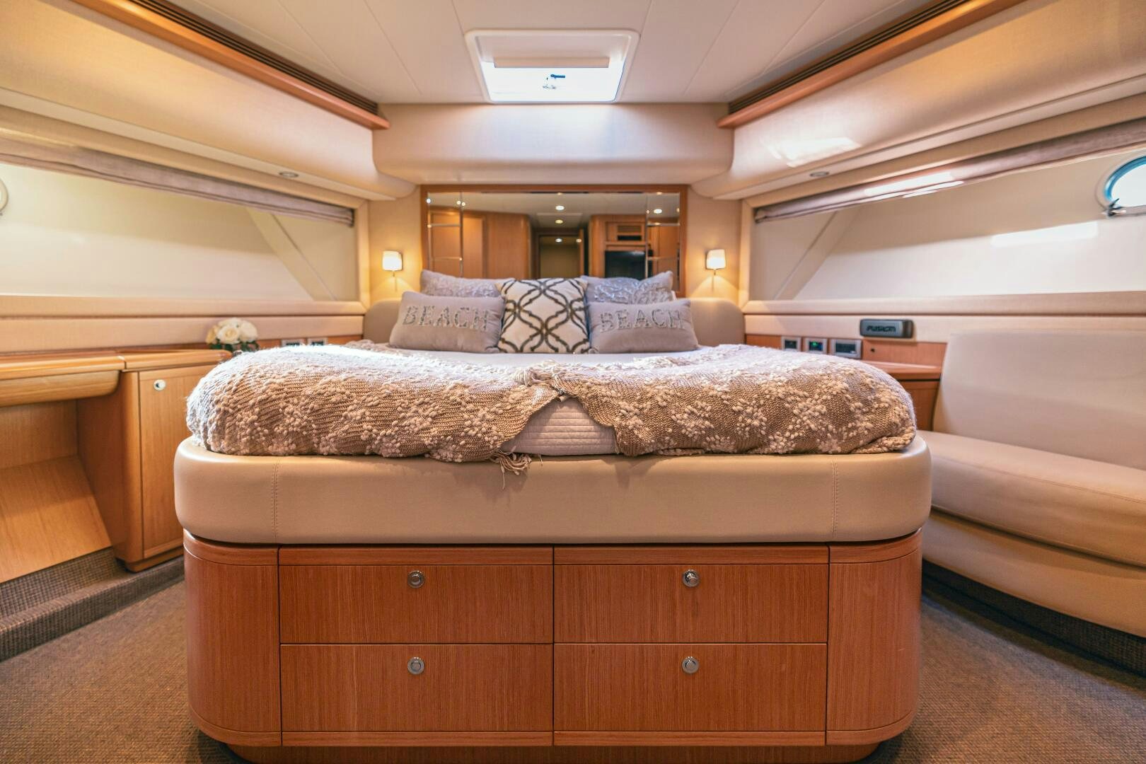 a bed with a wooden headboard aboard CRYSTAL PARROT Yacht for Sale