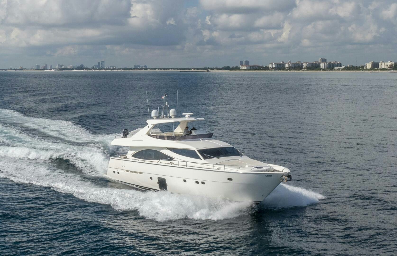 a white yacht on the water aboard CRYSTAL PARROT Yacht for Sale