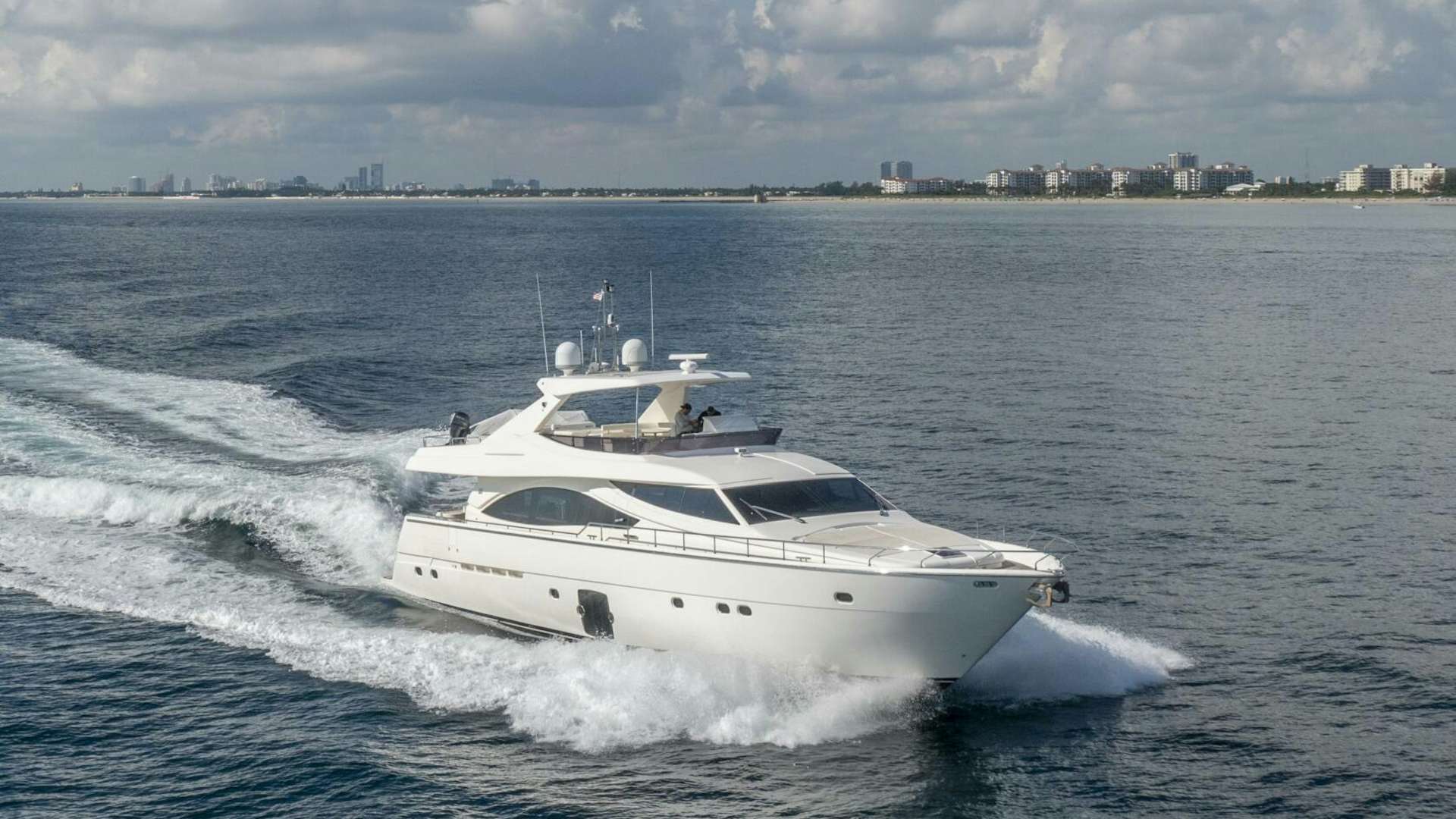 a white yacht on the water aboard CRYSTAL PARROT Yacht for Sale