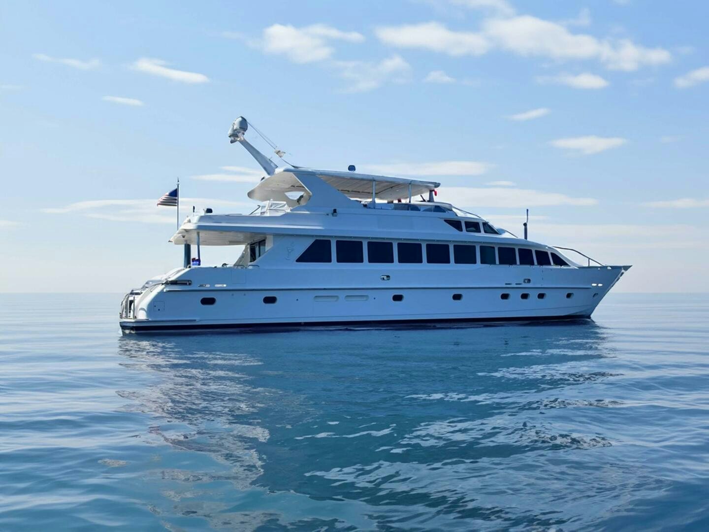 a white boat in the water aboard TUFF SHIP Yacht for Sale