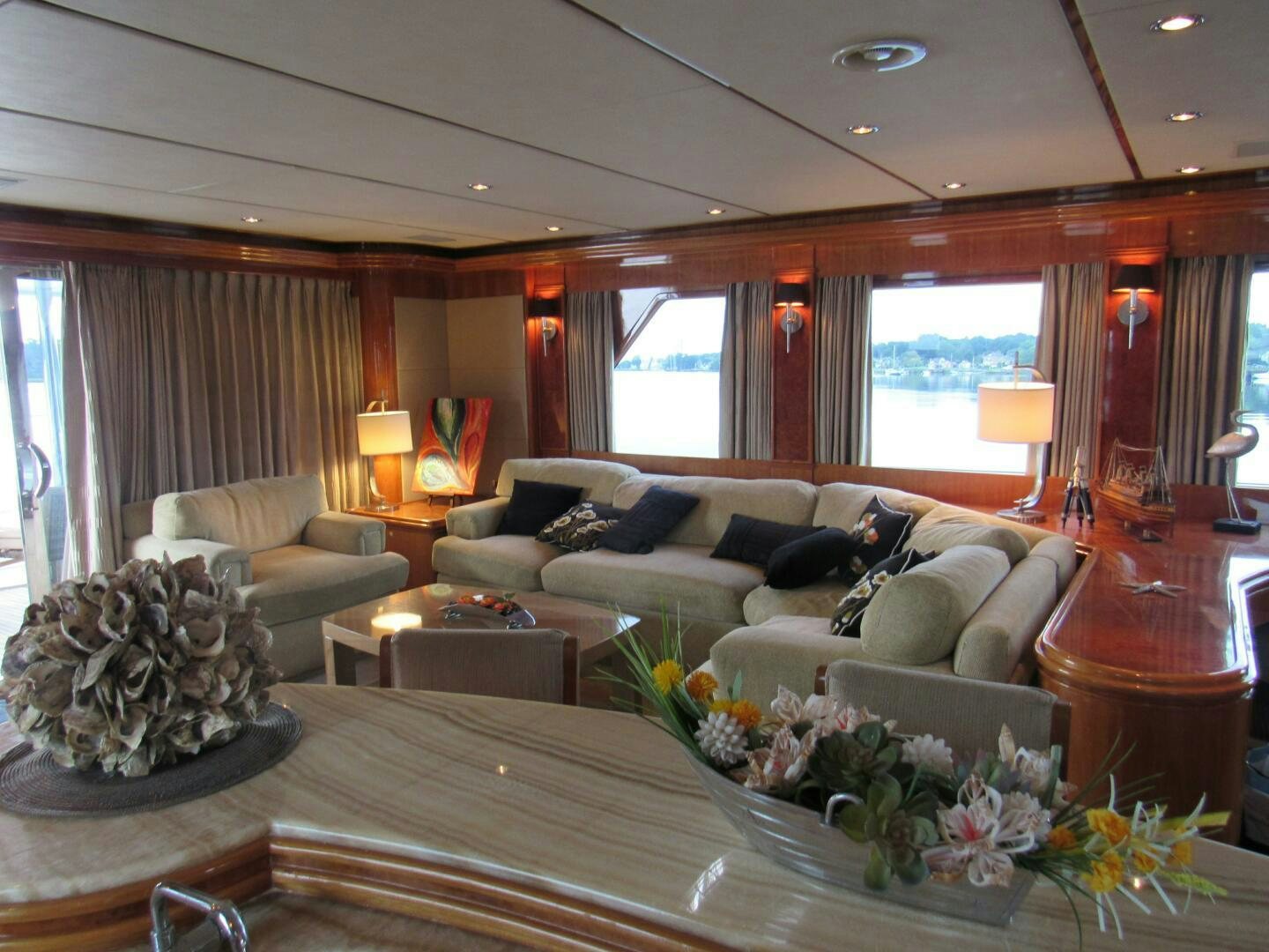 a living room with a large window aboard MOJITO Yacht for Sale