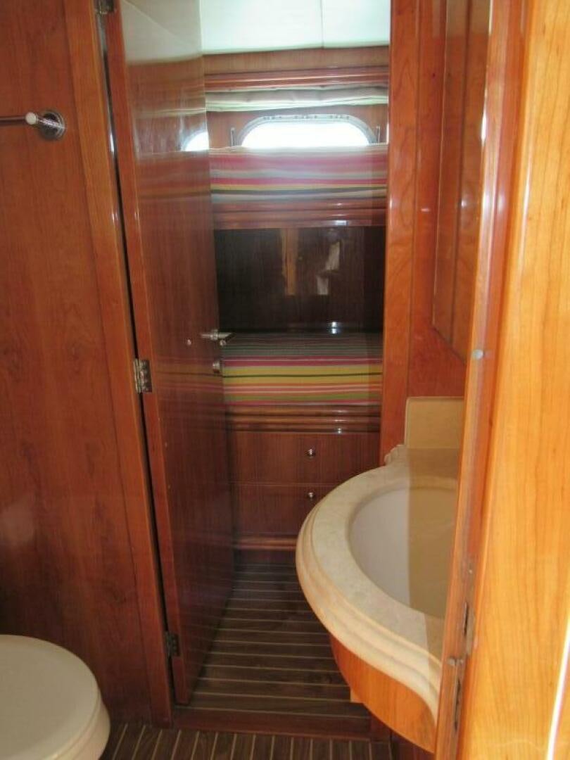 a bathroom with a sink and a toilet aboard MOJITO Yacht for Sale