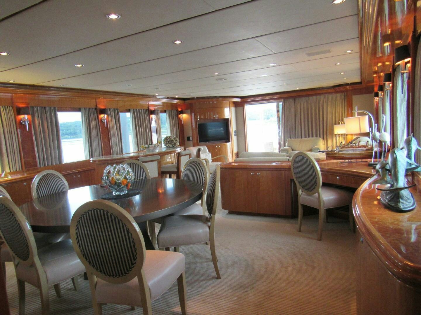 a large dining room with a table and chairs aboard MOJITO Yacht for Sale