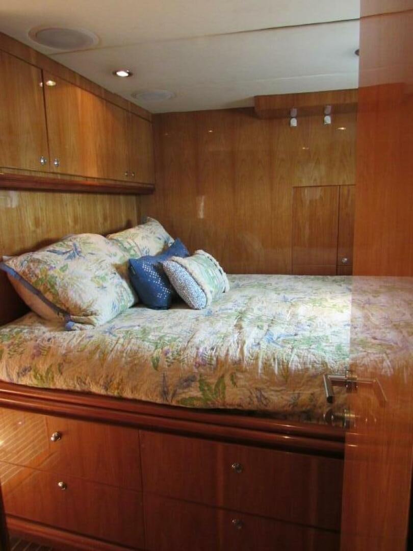 a bed in a room aboard MOJITO Yacht for Sale