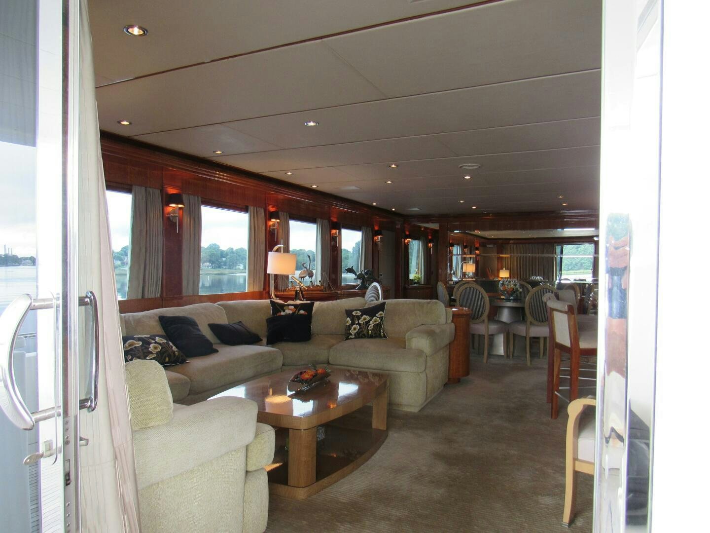 a living room with a couch and a table aboard MOJITO Yacht for Sale