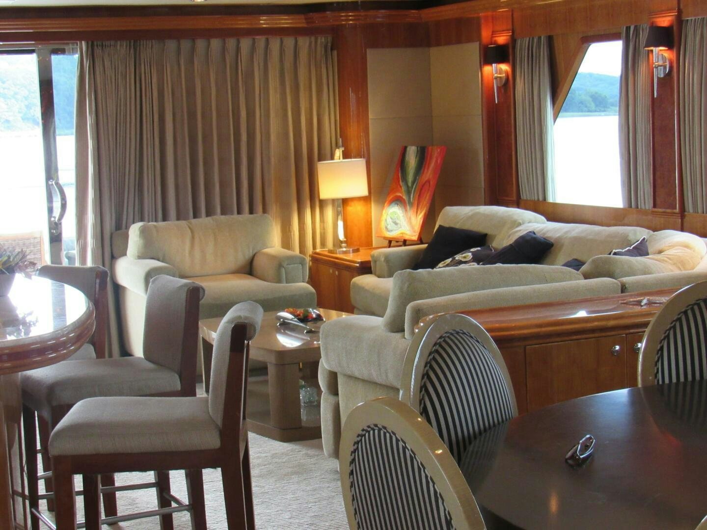 a living room with a couch and a table aboard MOJITO Yacht for Sale