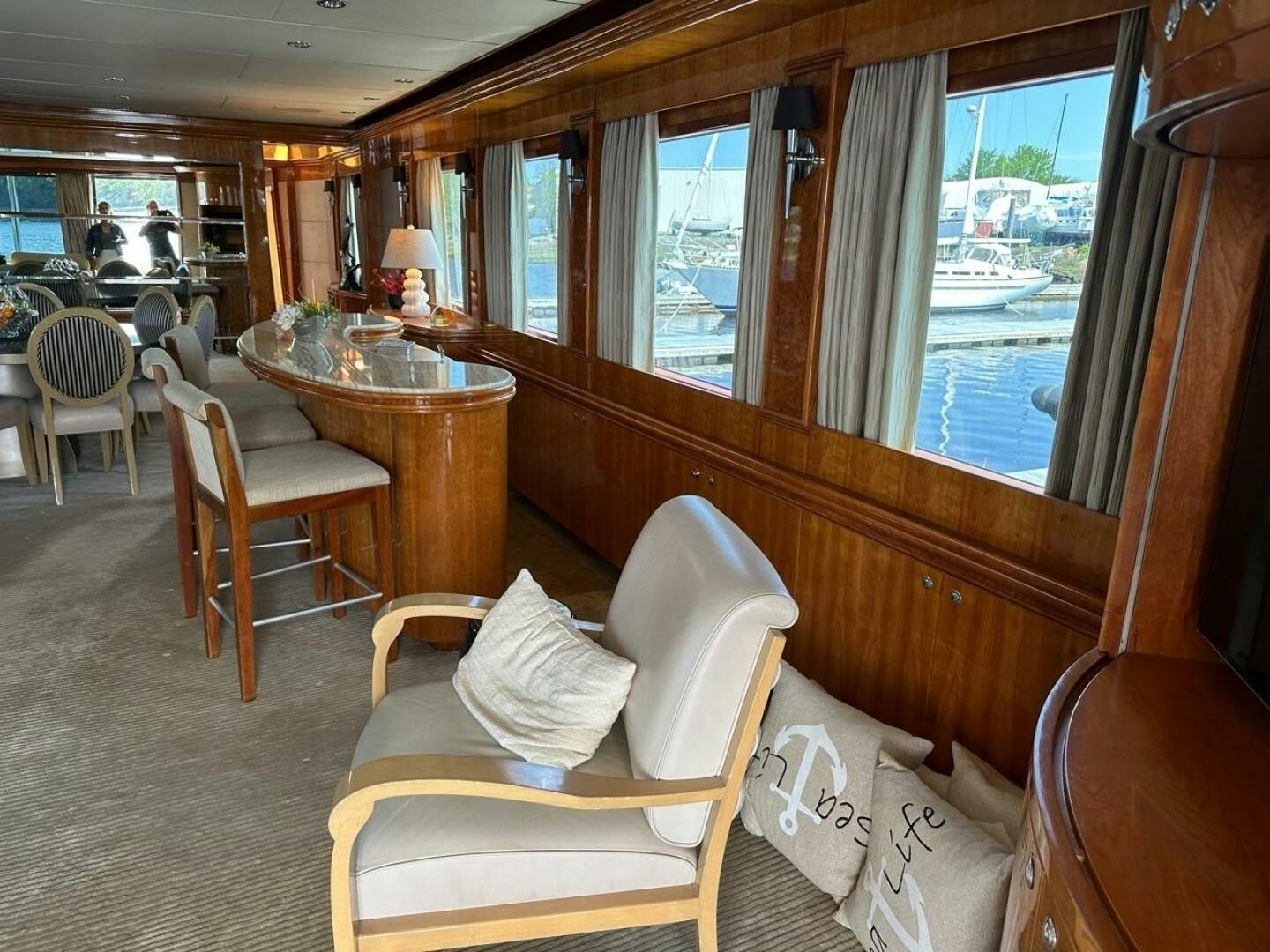 a train car with a table and chairs aboard MOJITO Yacht for Sale
