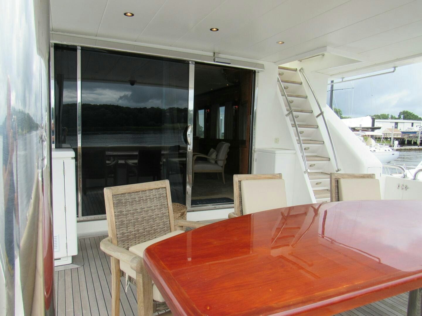 a table and chairs on a deck aboard MOJITO Yacht for Sale