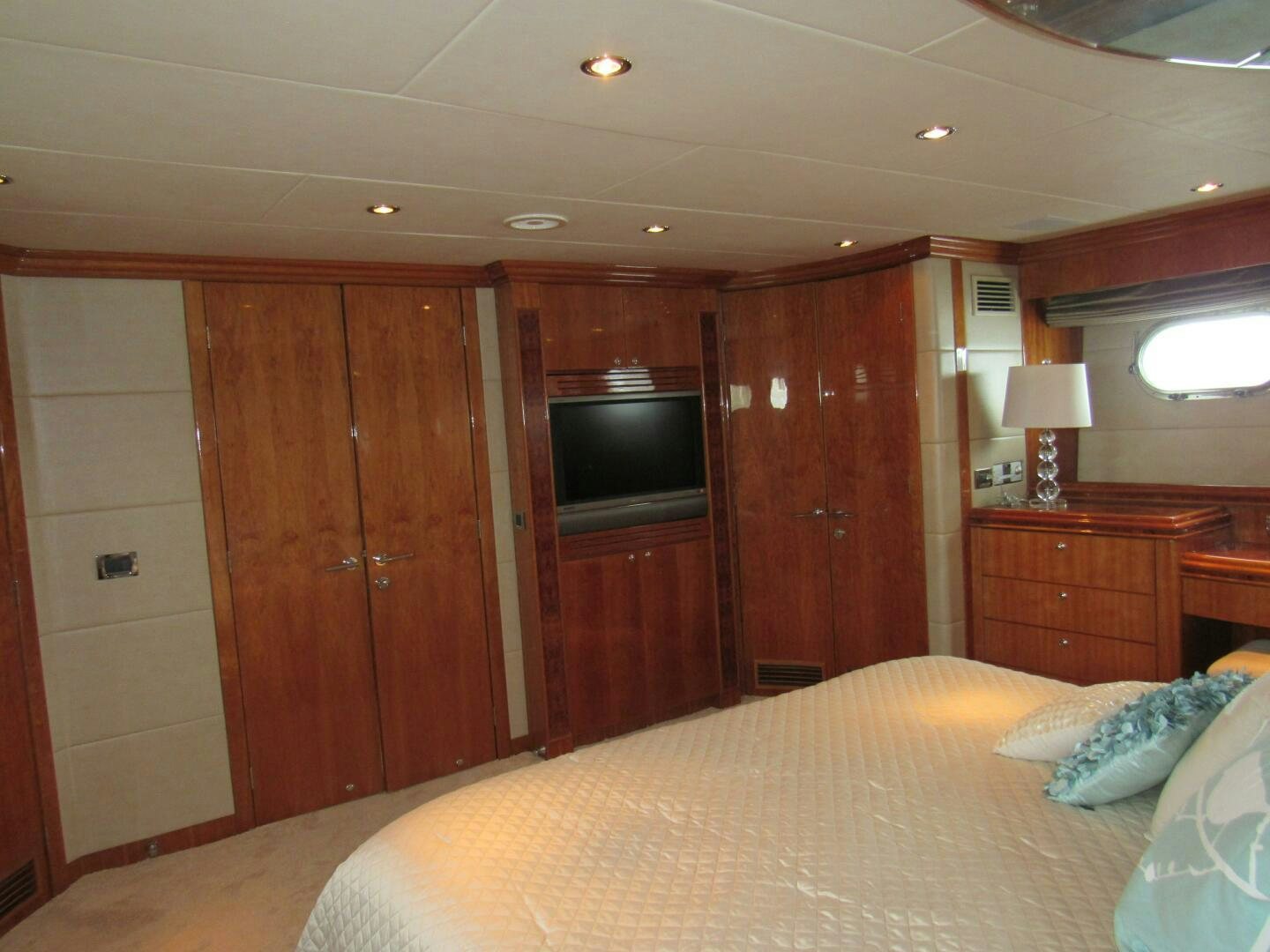 a bedroom with a bed and a television aboard MOJITO Yacht for Sale